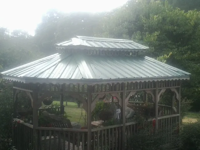 Two tier green metal roof on a garden gazebo in The Dalles
