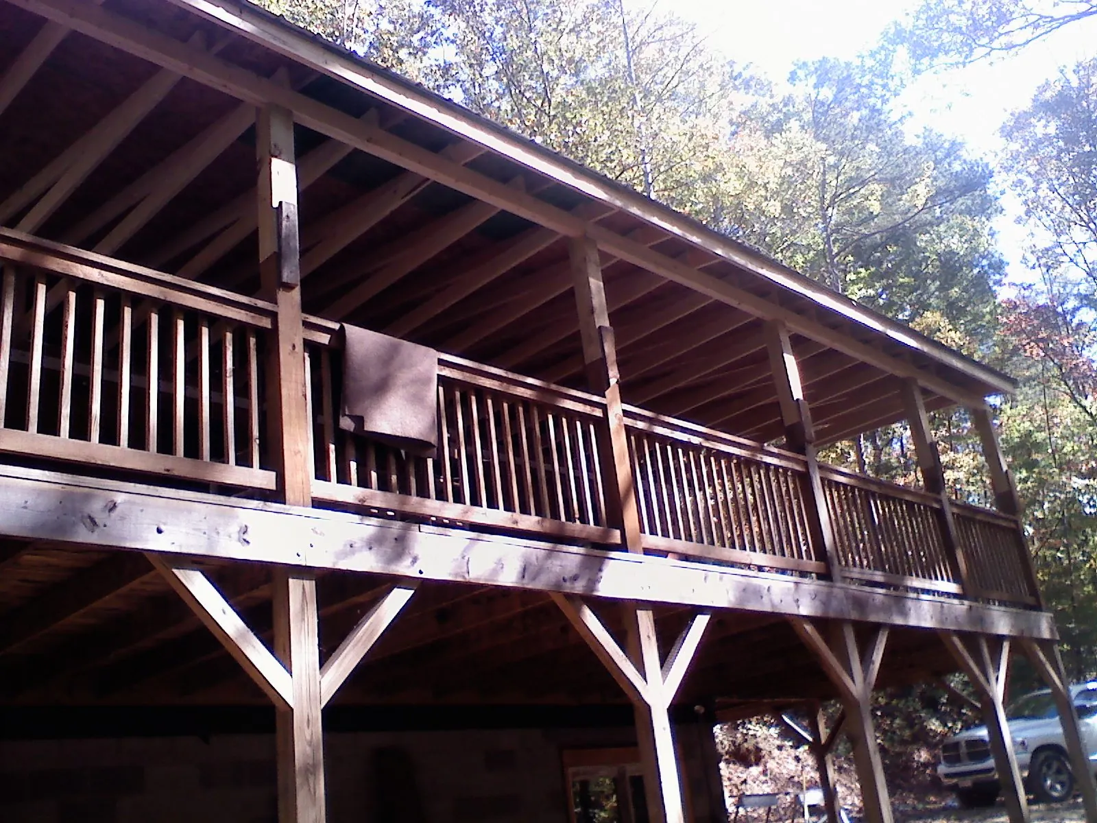 Timber framing under a new elevated porch and deck — Roof Leak Repair in The Dalles by Roofing Brothers